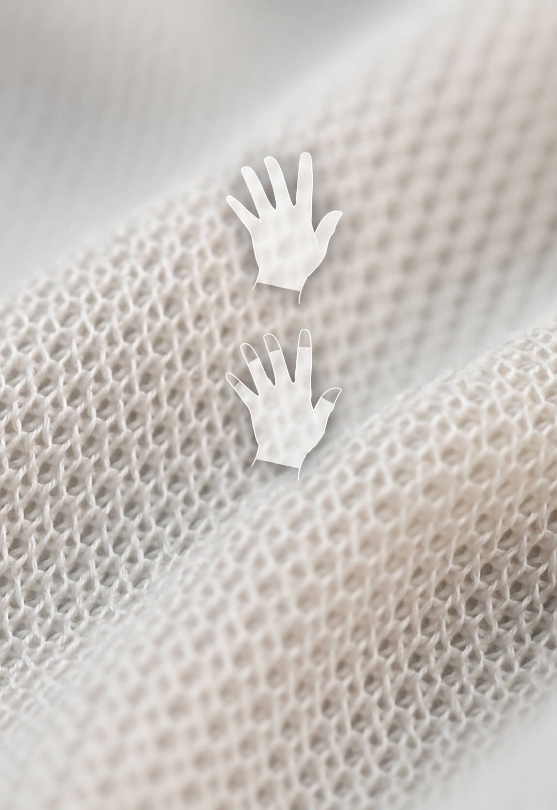 Zoom macro sur le textile doux et respirant deuxième peau®, conçu pour protéger les mains et apaiser les peaux sensibles atteintes d’eczéma.
